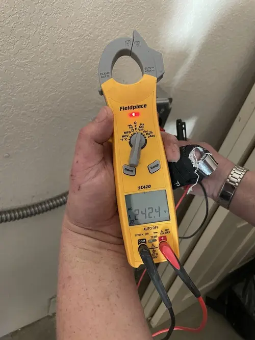 Voltage testing with clamp meter during Whole House Surge Protector in Hilliard